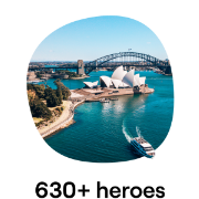 Aerial view of the Sydney Opera House and Harbour Bridge, capturing the vibrant waters of Sydney Harbour and an iconic ferry