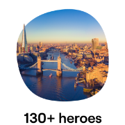 An aerial view of London featuring the iconic Tower Bridge and the River Thames, with the city's skyline bathed in golden light