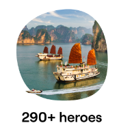 Traditional junks with red sails cruising in the calm waters of Ha Long Bay, Vietnam, surrounded by lush limestone karsts and emerald green waters