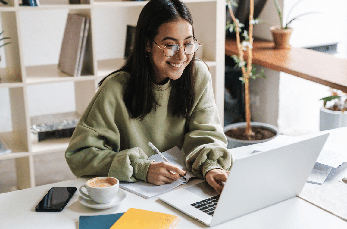 image of a woman at her laptop - Small Business Technology Investment Boost