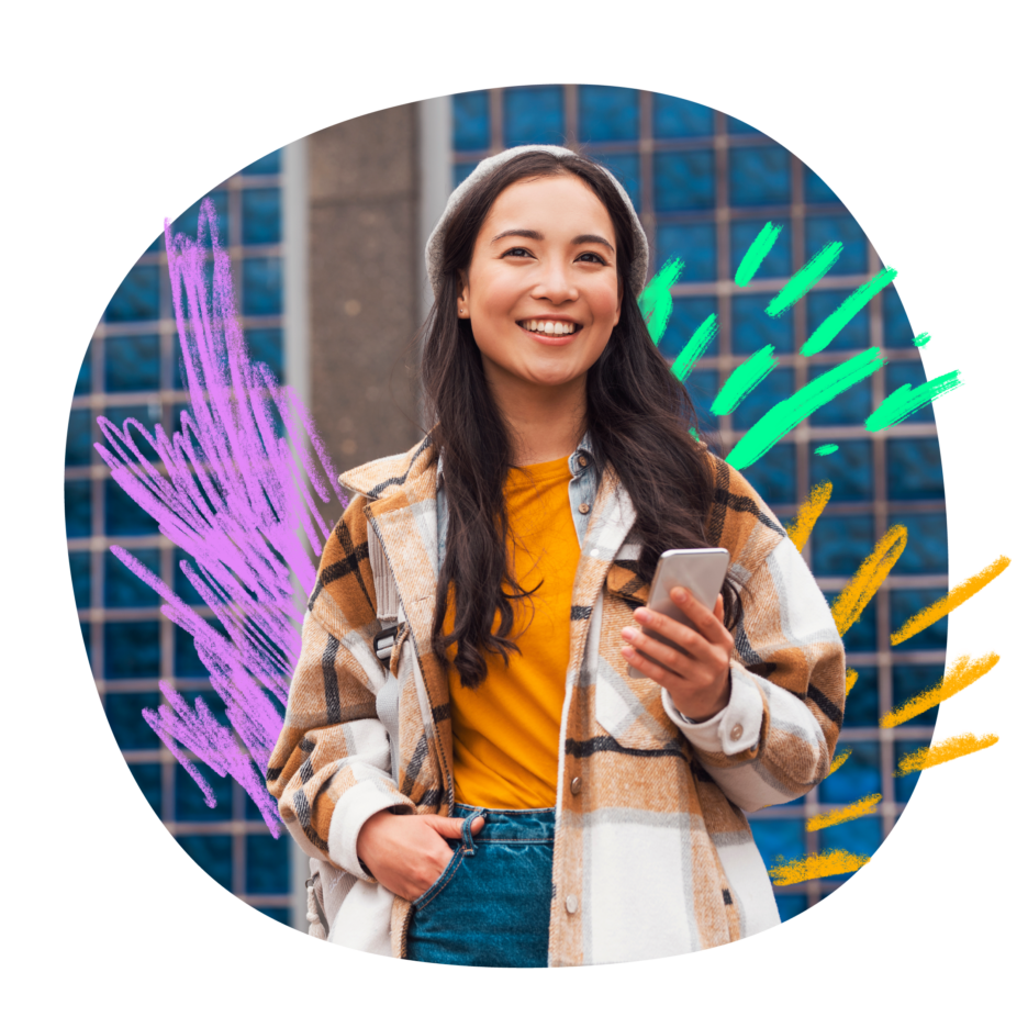 A smiling young woman holding her phone while standing against a building wall with artistic purple and teal brushstroke accents.
