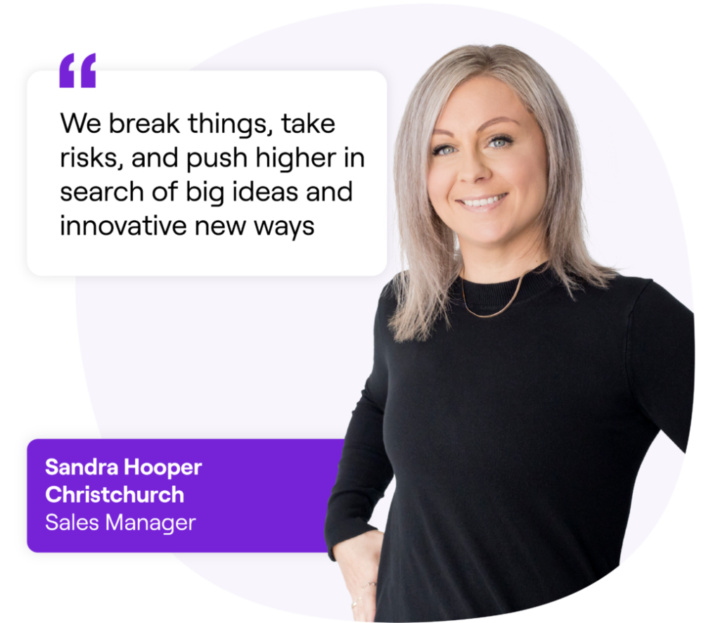 Smiling woman wearing a black long sleeve shirt, standing casually. Next to her is a quote that reads: 'We break things, take risks, and push higher in search of big ideas and innovative new ways.' Text box below reads: 'Sandra Hooper, Christchurch, Sales Manager.